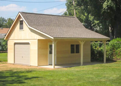 two story cabin with garage door