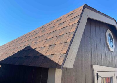 barn building with shingle roof