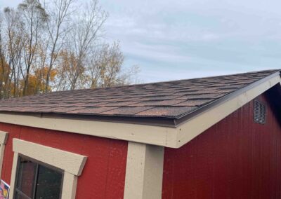 gable shed with shingle roof