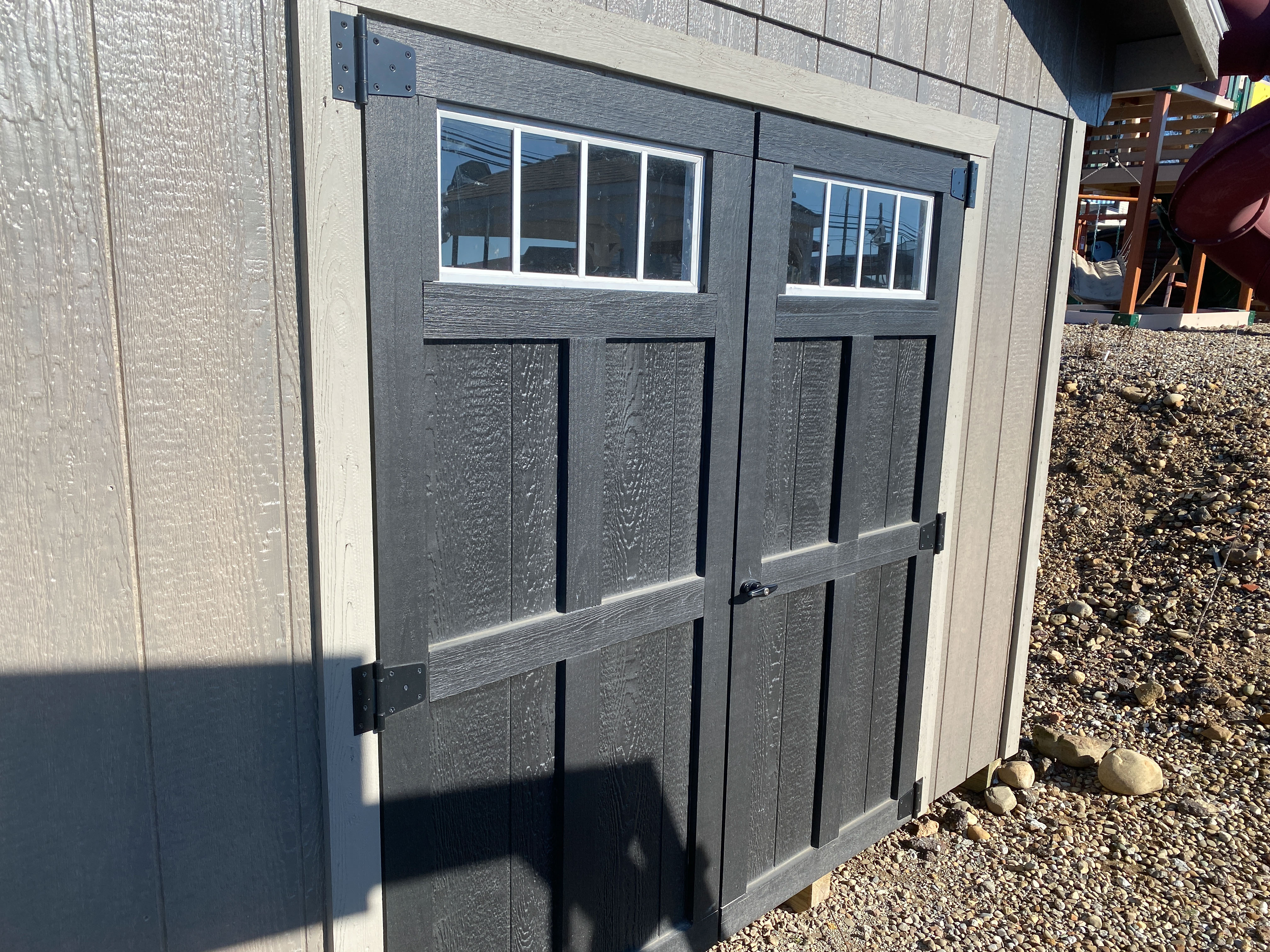 prefab cabin with porch with double door with transom windows