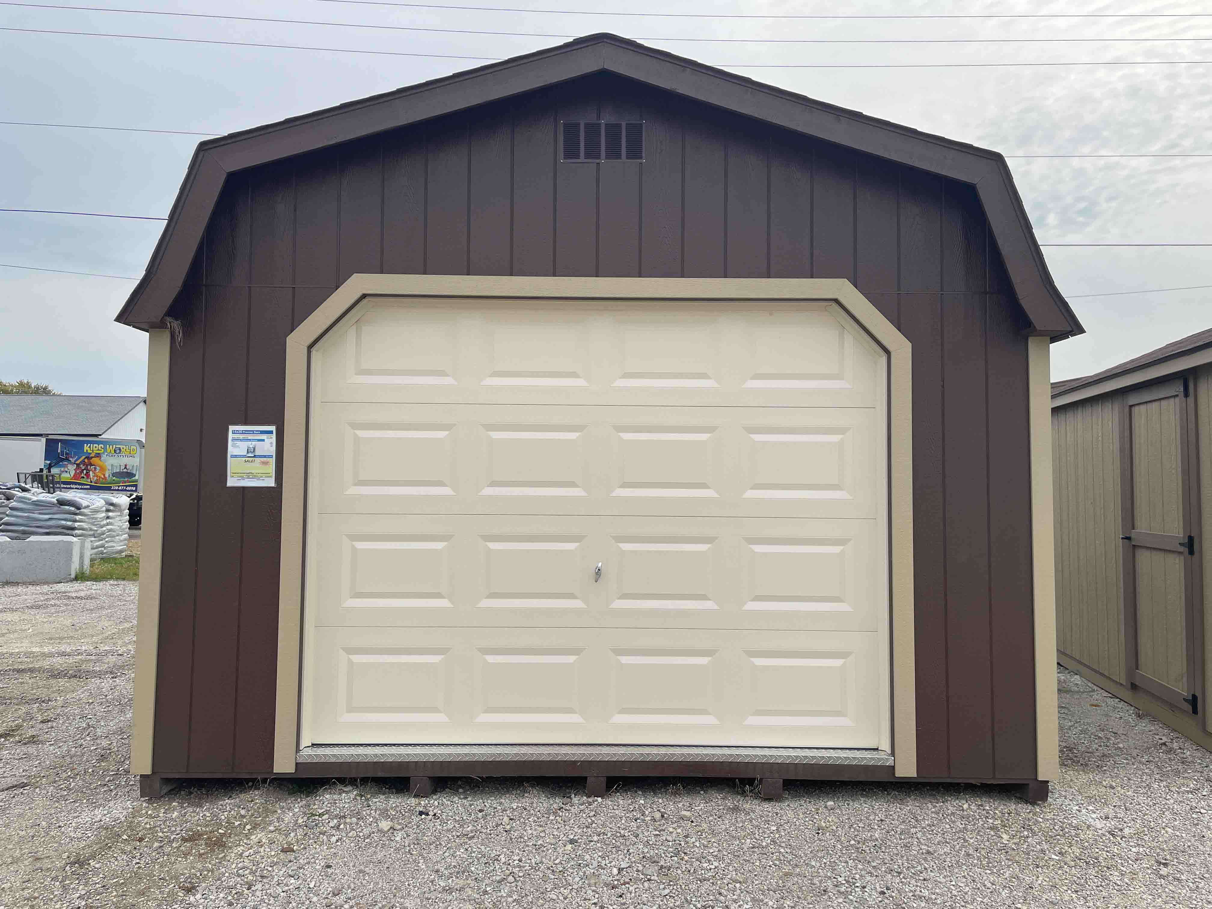 outdoor wood storage shed with garage door